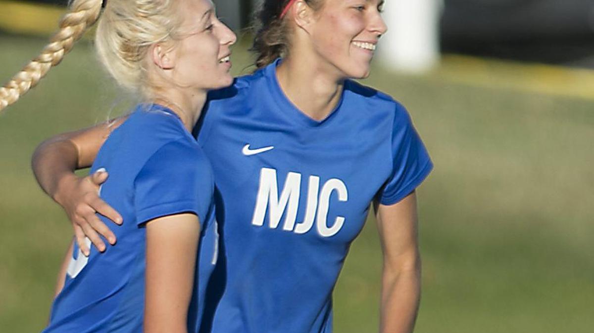 Jenna Viss, right, Jazlyn Satkamp and the Pirates saw their season end Friday.