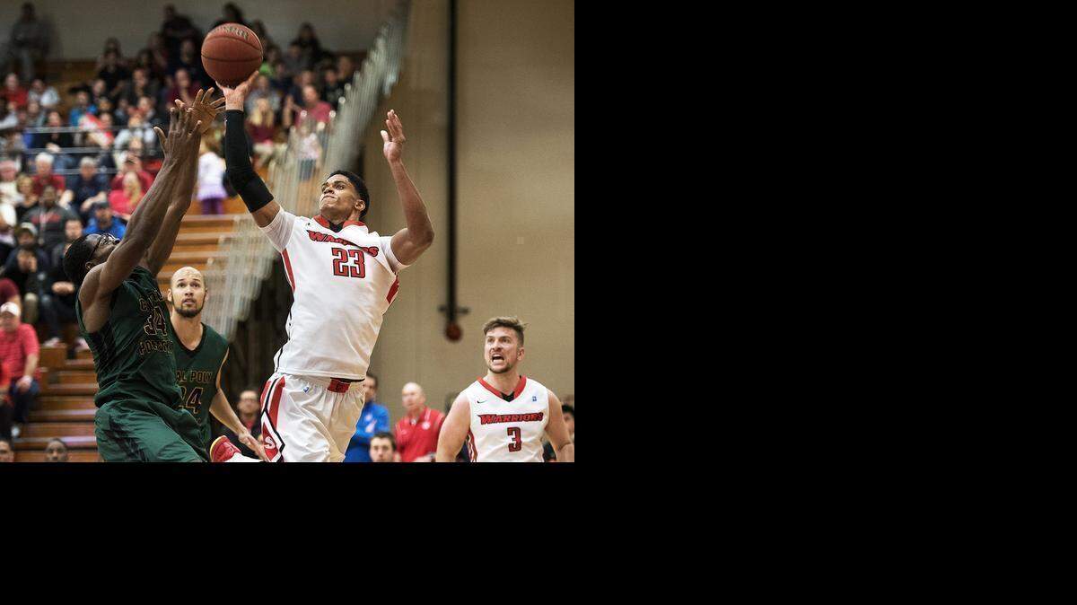 Cal State Stanislaus’ <137>Forward <137>Wes Bartole puts up a shot as Cal Poly Pomona’s Francois Tchoyi defends in Friday night’s game. <137>during the California Collegiate Athletic Association game at California State University, Stanislaus in Turlock on Friday, February, 06, 2015.<137>