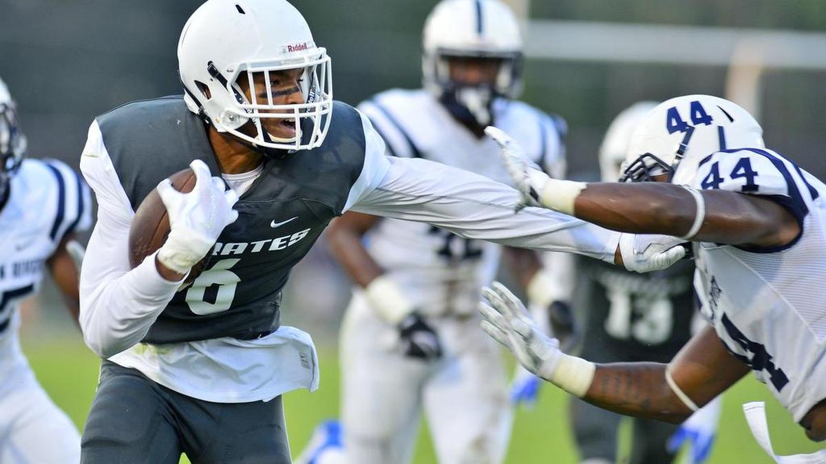 MJC receiver Michael Thompson (6) stiff arms a defender during a game between Modesto Junior College and American River College at Modesto Junior College in Modesto California on September 9, 2017.