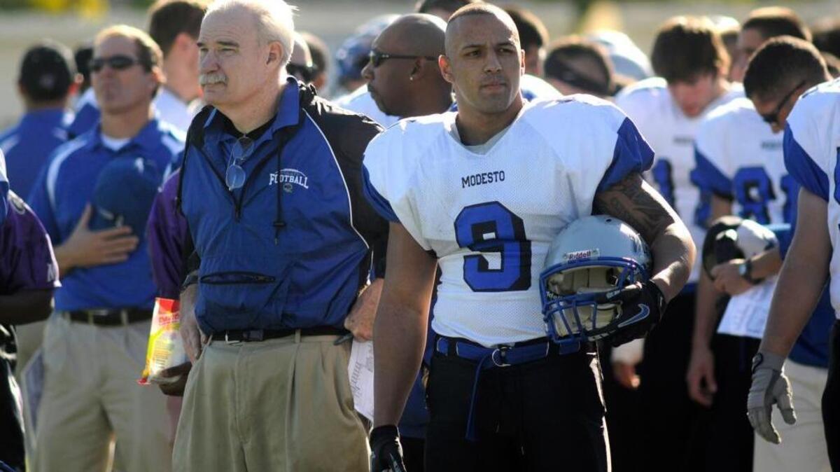 Sam Young and Markus Sanders (9) stand for the national anthem before the Graffitit Bowl in Modesto in 2011.