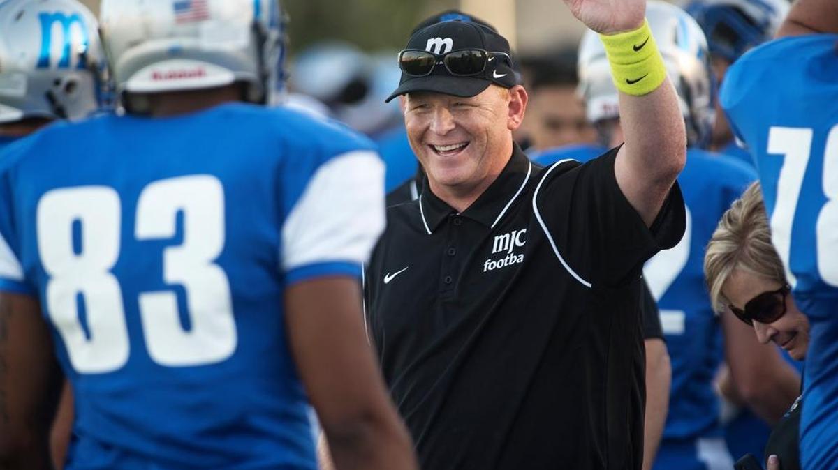 Modesto’s coach Rusty Stivers celebrates a first half touchdown during the opening game with American River College at Modesto Junior College in Modesto, Calif., on Saturday, Sept. 5, 2015.