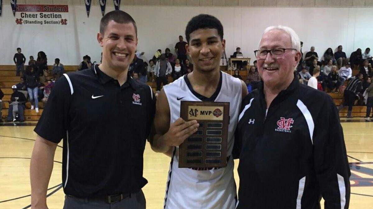 Modesto Christian junior Dathan Satchell, pictured here with current coach Brice Fantazia and former MC coach Gary Porter (right), scored 21 points in the Crusaders' victory over Campolindo in the second round of the 18th annual Holiday Hoop Classic on Thursday, Dec. 28, 2017.