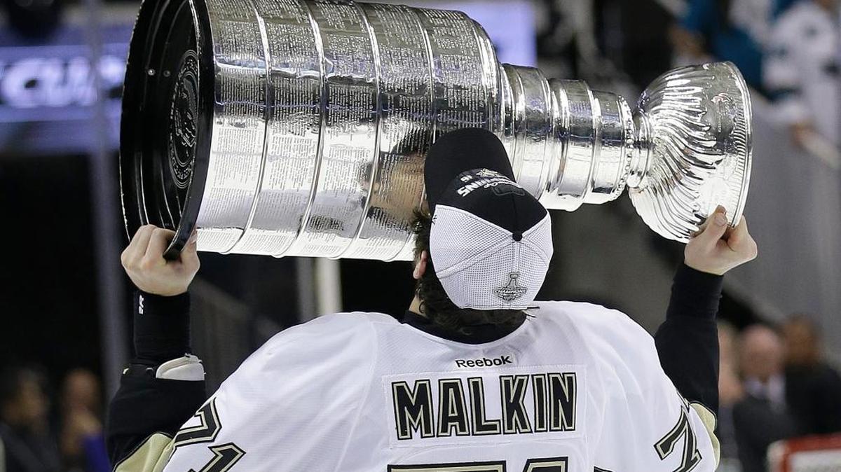 Pittsburgh center Evgeni Malkin kisses the Stanley Cup after the Penguins beat the Sharks 3-1 in Game 6 to win the title on Sunday in San Jose.