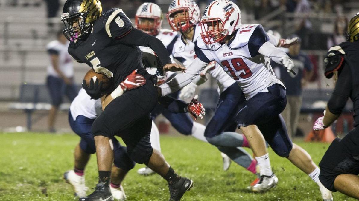 Enochs Highs Akari Bowens(5) get chased down by Beyer Highs Ben Polack(19) during Friday nights game.