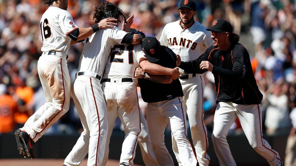 Conor Gillaspie is mobbed by his Giants teammates after delivering the game-winning run with a double in the ninth inning on Sunday, June 26, 2016, at AT&T Park in San Francisco.