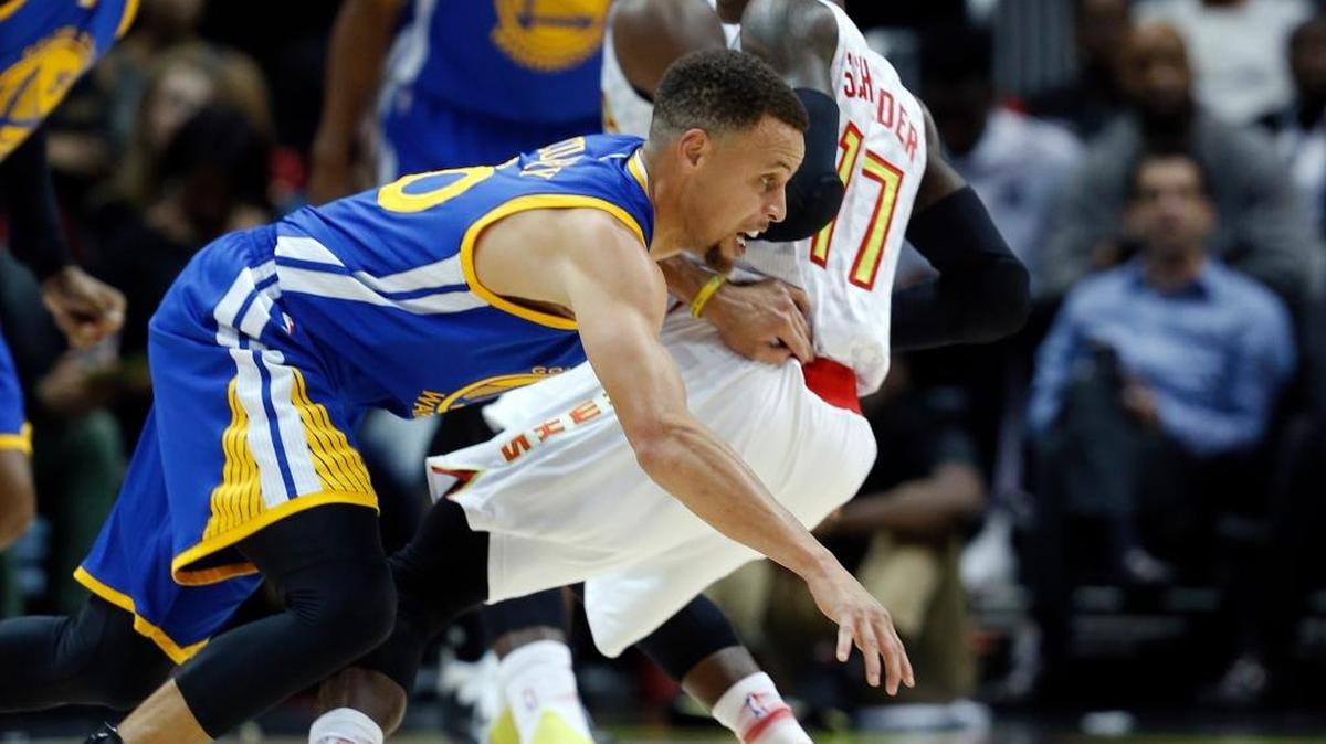 Golden State Warriors guard Stephen Curry (30) drives against Atlanta Hawks guard Dennis Schroder (17) during an NBA basketball game Monday, Feb. 22, 2016, in Atlanta. Curry led all scorers with 36 points.