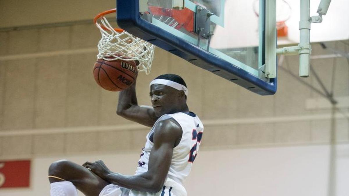 Modesto Christian forward Robinson Idehen (23) dunks the ball during a game between Modesto Christian and Bishop O'Dowd at Modesto Christian High School in Modesto California on December 5, 2015.