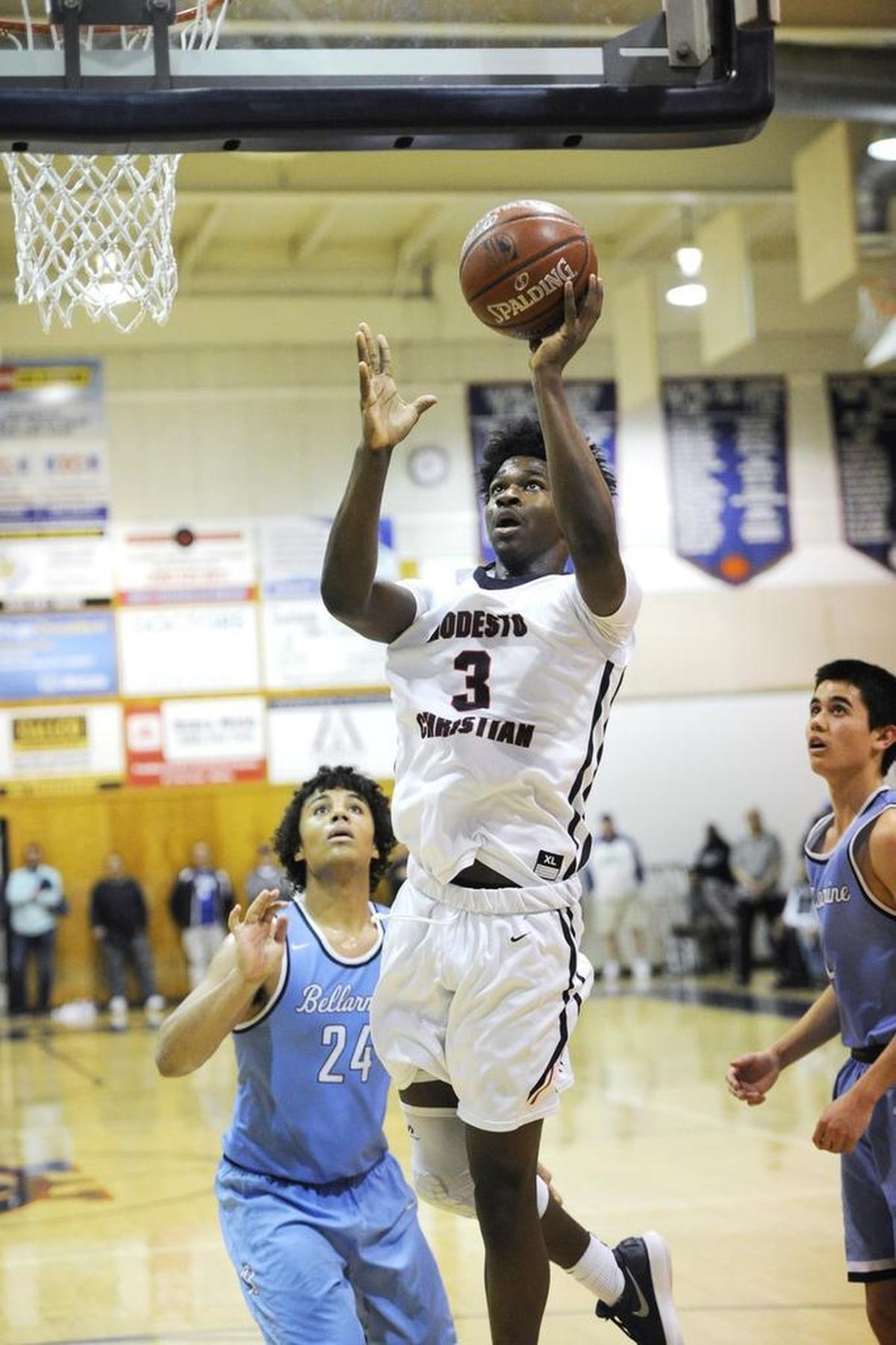 Modesto Christian’s Aaron Murphy scores during the first round of the CIF State Open Division Northern California regional tournament game with Bellarmine in Salida, Calif., on Friday, March 9, 2018.