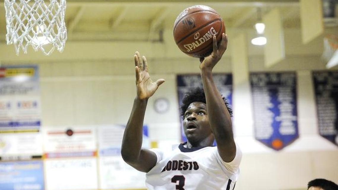 Modesto Christian’s Aaron Murphy scores during the first round of the CIF State Open Division Northern California regional tournament game with Bellarmine in Salida, Calif., on Friday, March 9, 2018.