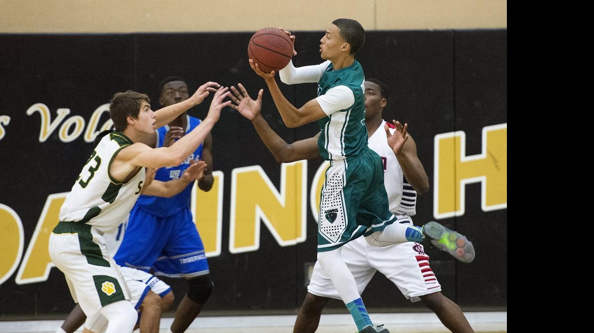 Central Valley's Jaron Dickson makes a pass during the 6-County All-Star basketball game at Enochs High School in Modesto on Friday.