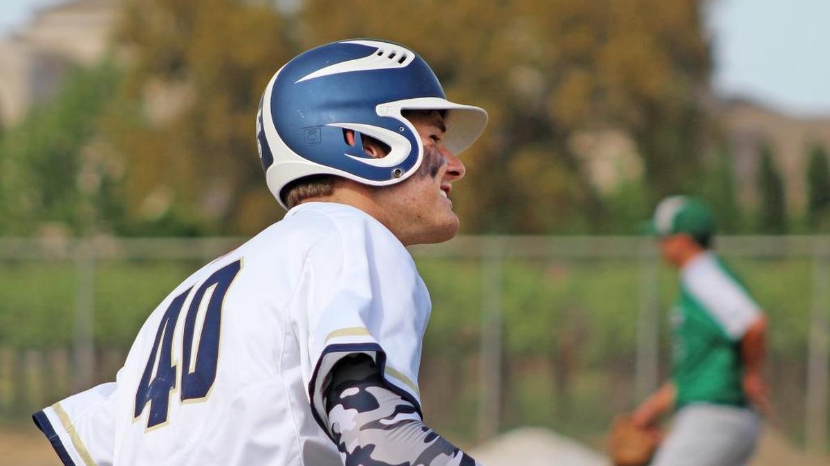 Central Catholic slugger Sam Mundt is all smiles as he rounds the bag at third base after belting a three-run home run against Manteca on Wednesday, April 20, 2016, at Central Catholic High.