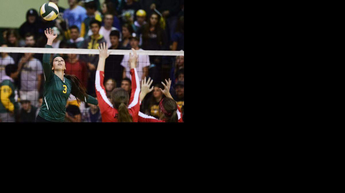 
Hilmar junior Emily Baptista (3) tips the ball over the net during the Sac-Joaquin Section Division IV semifinals game against Ripon at Hilmar High School in Hilmar, Calif., Tuesday, Nov. 18, 2014. The Yellowjackets defeated the Indians 25-18, 25-15, 25-21.
