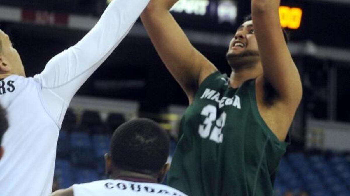 Manteca's Arand Hundal shoots over Weston Ranch defense during the first half of the Sac-Joaquin Section Division III Championship game on Friday (03-04-16) at Sleep Train Arena in Sacramento.