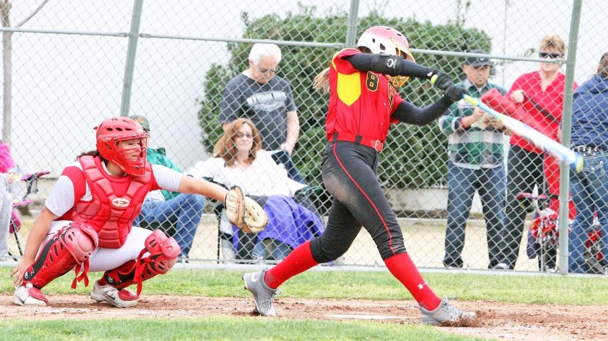 Oakdale senior leadoff hitter Kindra Hackbarth hits a single to left field during the first inning of an 11-0 victory over Ceres High on Thursday, March 10, 2016.