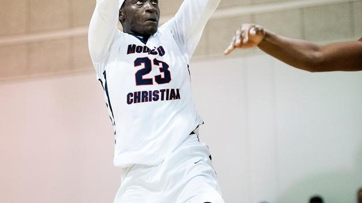Modesto Christian's Robinson Idehen dunks during the Modesto Christian Holiday Hoops Classic game with Salesian in Modesto, Calif., on Tuesday, Dec. 29, 2015.
