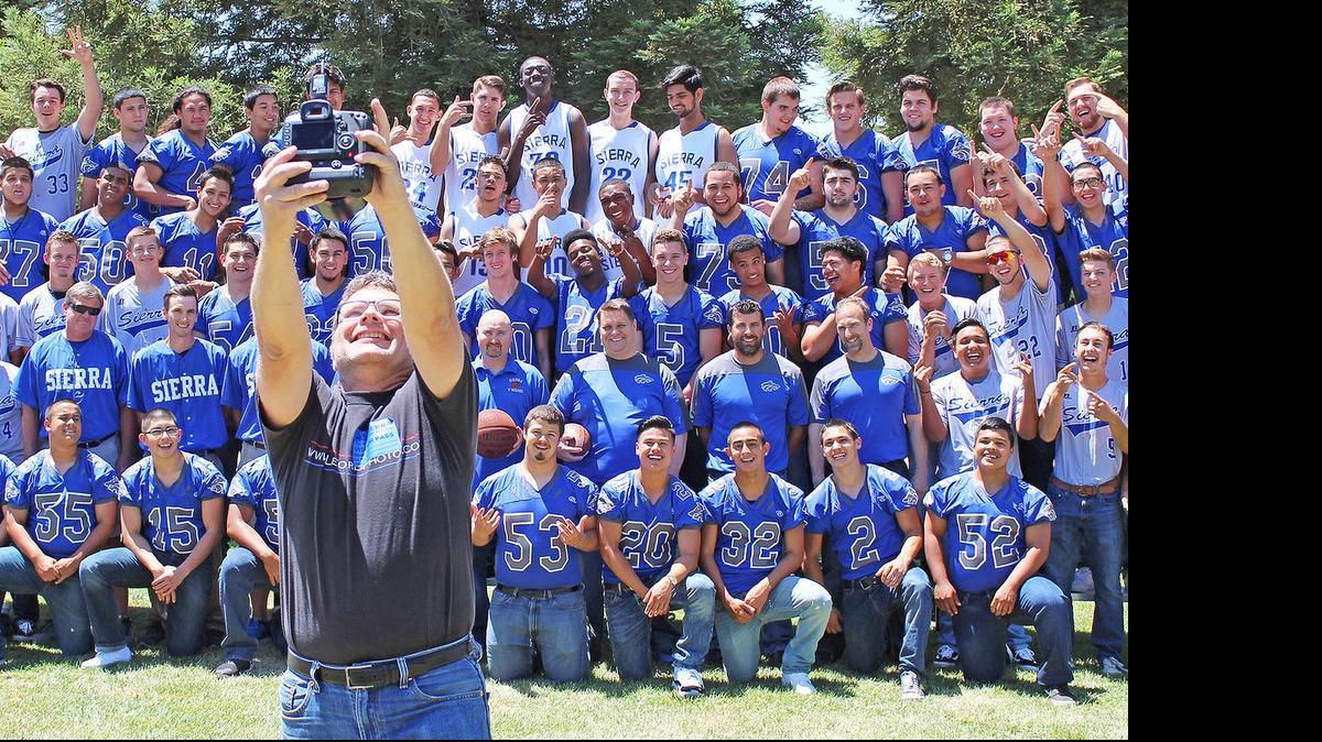 
Photographer Christopher Leonard snaps a selfie with members of the three Valley Oak League championship teams at Sierra High on Wednesday in Manteca. The Timberwolves became the first school in the VOL’s modern history to win football, boys basketball and baseball titles in the same academic year.
