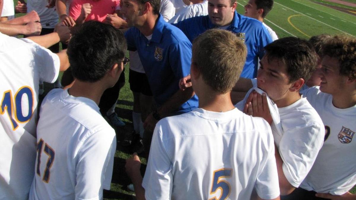 Ripon Christian coach Keith Terpsma, center, has a short talk with this team following the Knights 4-1 victory over Sacramento Country Day in the championship game of the Sac-Joaquin Section Division VII tournament on Saturday, Nov. 15, 2014, at Amos Alonzo Stagg High in Stockton, CA