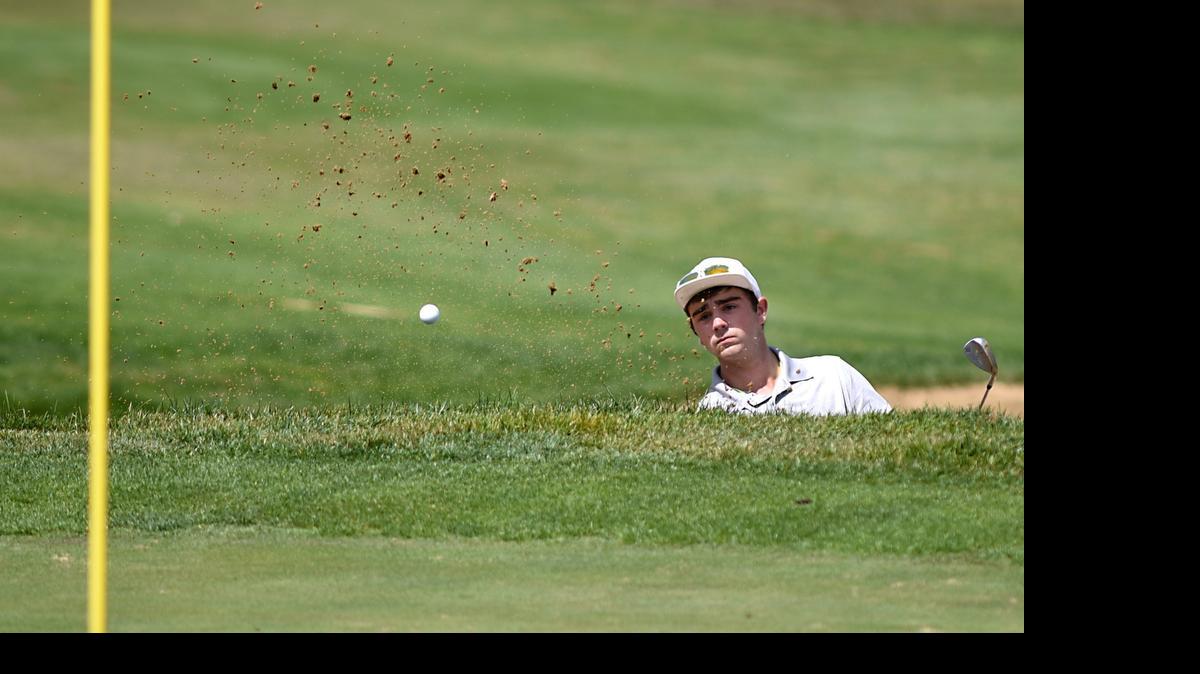 
Logan Lundquist, of Turlock Christian School hits his ball out of the bunker on the ninth hole on Monday morning (05-11-15) at The Reserve At Spanos Park in Stockton, Calif. during the CIF Sac-Joaquin Section Masters Golf Championships.
