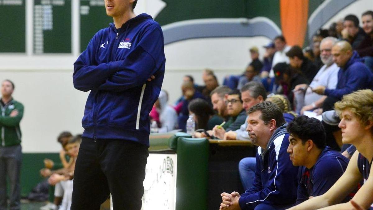 Beyer head coach Kyle McKim watched his team play from the sidelines during a game between Beyer and Manteca at Manteca High School in Manteca California on December 23, 2016.