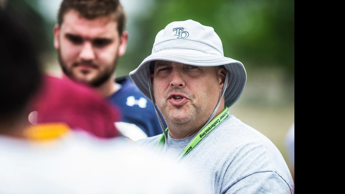 
South All-Star team coach Jeremy Plaa instructs players during practice for the Lions All-Star Football game at Stanislaus State this week.
