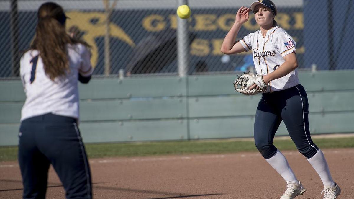 Gregori pitcher Maikyla Nelson flips the ball to first baseman Tiana Lancaster during the Modesto Metro Conference game with Downey in Salida, Calif., on Tuesday, March 28, 2017.