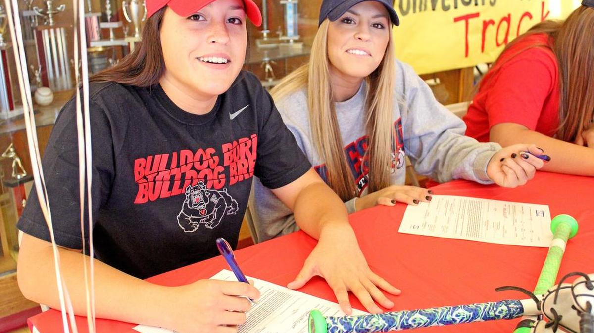 Twin sisters Maddi and Kindra Hackbarth signed national letters of intent to play softball at Fresno State on Thursday, Nov. 11, 2015, during a signing party at Oakdale High in Oakdale Calif. The Hackbarth sisters were joined by four other student-athletes.