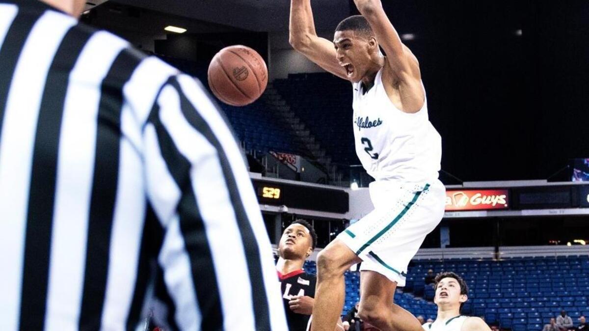 Manteca’s Kenny Wooten dunks in the fourth quarter of the Buffaloes win over Ayala in the CIF State Division III championship game at Sleep Train Arena in Sacramento on Thursday, March, 24, 2016.