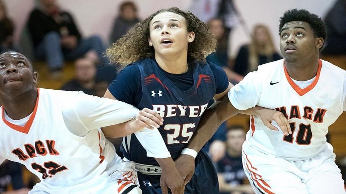 Beyer's Deangelo Dancer and McClymonds Dondald White, left, and Vernon Walker, right, prepare for a rebound from a free throw during the Modesto Christian Holiday Hoops Classic in Modesto, Calif., on Tuesday, Dec. 29, 2015.