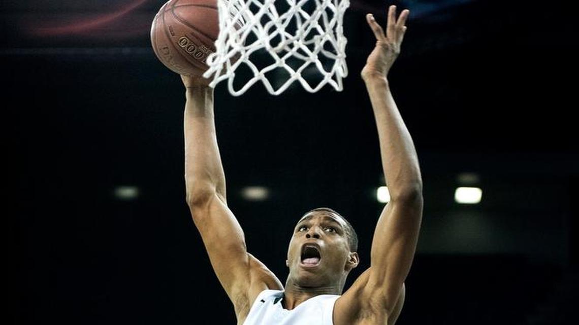 Manteca High’s Kenny Wooten executes an alley-oop dunk during the CIF State Division III championship game against Ayala at Sleep Train Arena in Sacramento on Thursday, March, 24, 2016.