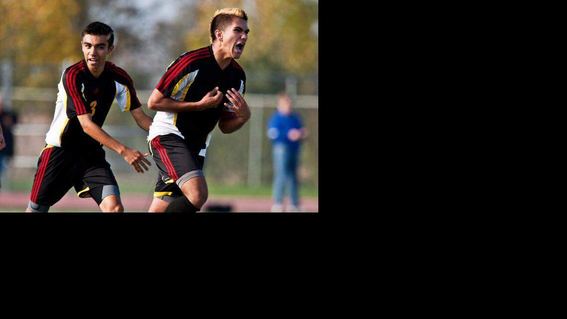 
Oakdale‘s Jose Becerra, right, and Josh Barrera (3) celebrate Becerra’s game-winning goal in overtime against Christian Brothers in the CIF Sac-Joaquin Division III championship game at Cosumnes Oaks High School in Elk Grove on Nov. 15. The Mustangs beat the Falcons 2-1 in overtime.
