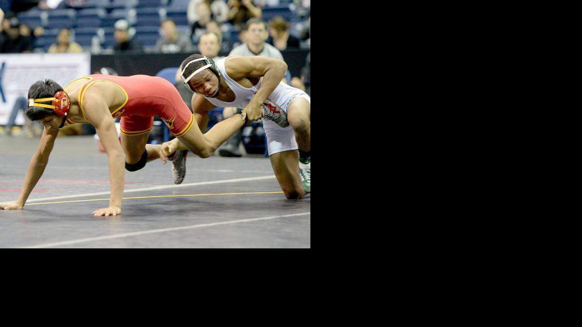 
Oakdale High's Nico Colunga scrambles to break free from Dixon's Devan Turner in the 120 Final during the Sac-Joaquin Section Masters Wrestling at the Stockton Arena on February 28th.
