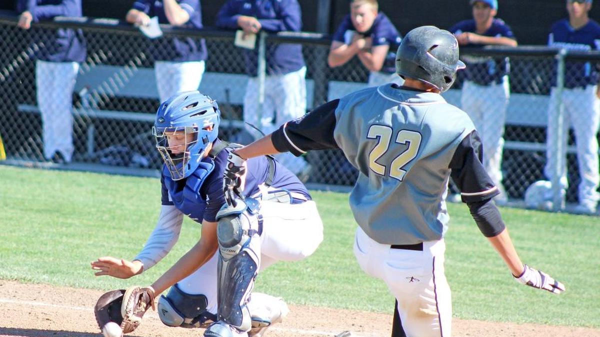 Enochs’ Adrian Gonzales slides into home plate ahead of the tag by Downey catcher Zach Cooper, but it wasn't enough in a 20-8 loss on Friday, April 15, 2016, at Dick Windemuth Field.