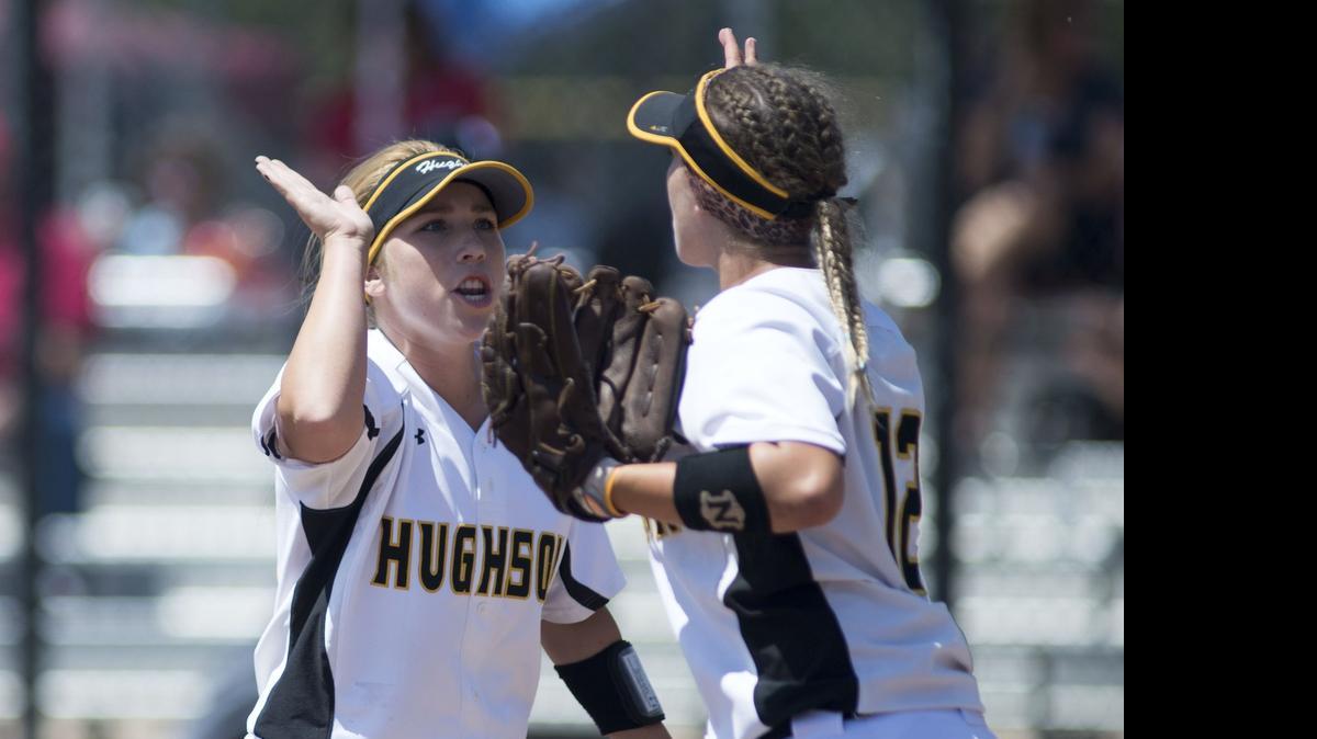 Hughson’s Courtney Thornhill (left) celebrates with Savannah Ahumada (right) after a quick inning in the Sac-Joaquin Section Division V final against Ripon.