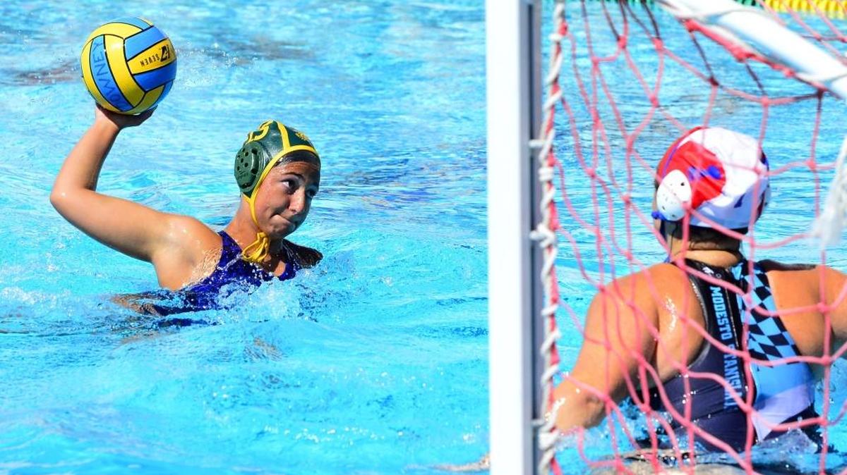 Elizabeth Taggar of SOAK, a team composed of players from Sonora and Oakdale, shoots on goal during the 16-and-under girls Junior Olympic Water Polo Zone Championships on Saturday at Downey High School. SOAK defeated Modesto-Stanislaus 17-3. Tournament play concludes today.