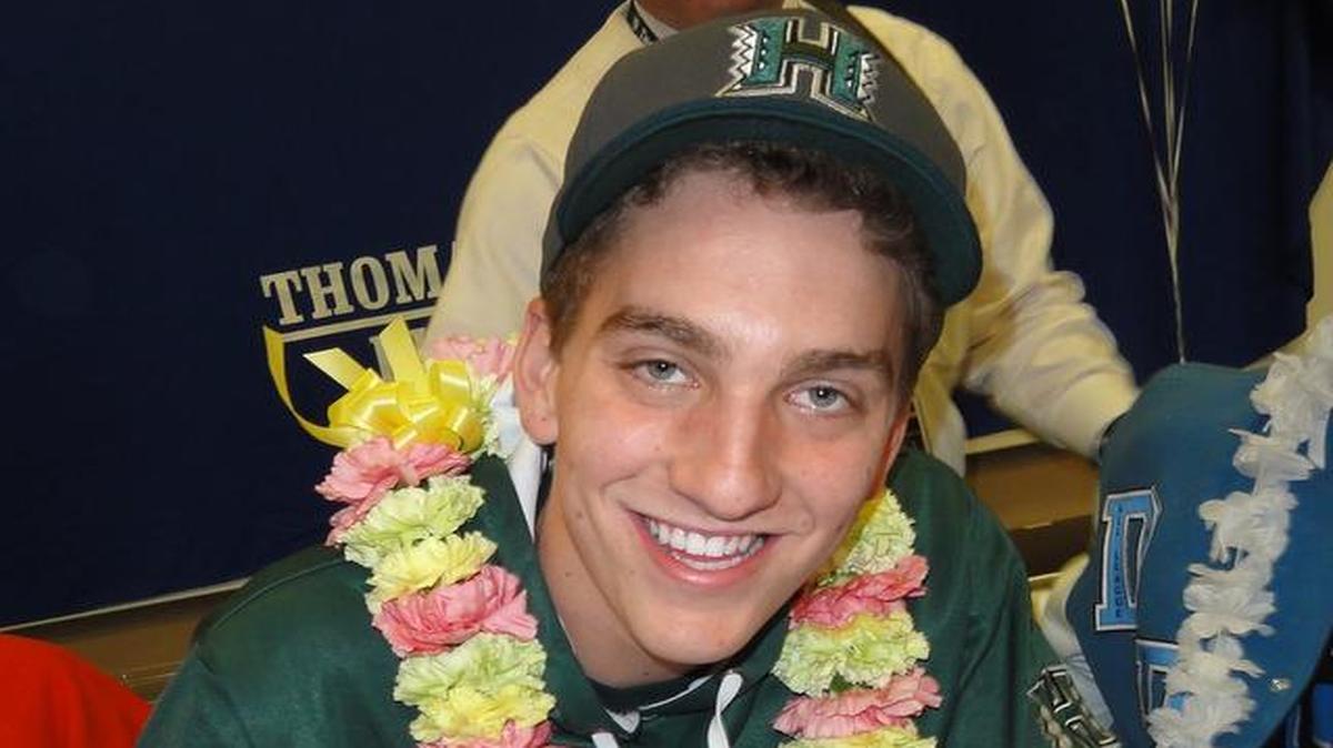 
Downey High School quarterback Aaron Zwahlen signs his letter of intent to play football at the University of Hawaii in February 2013 on the Modesto school’s campusl. 


