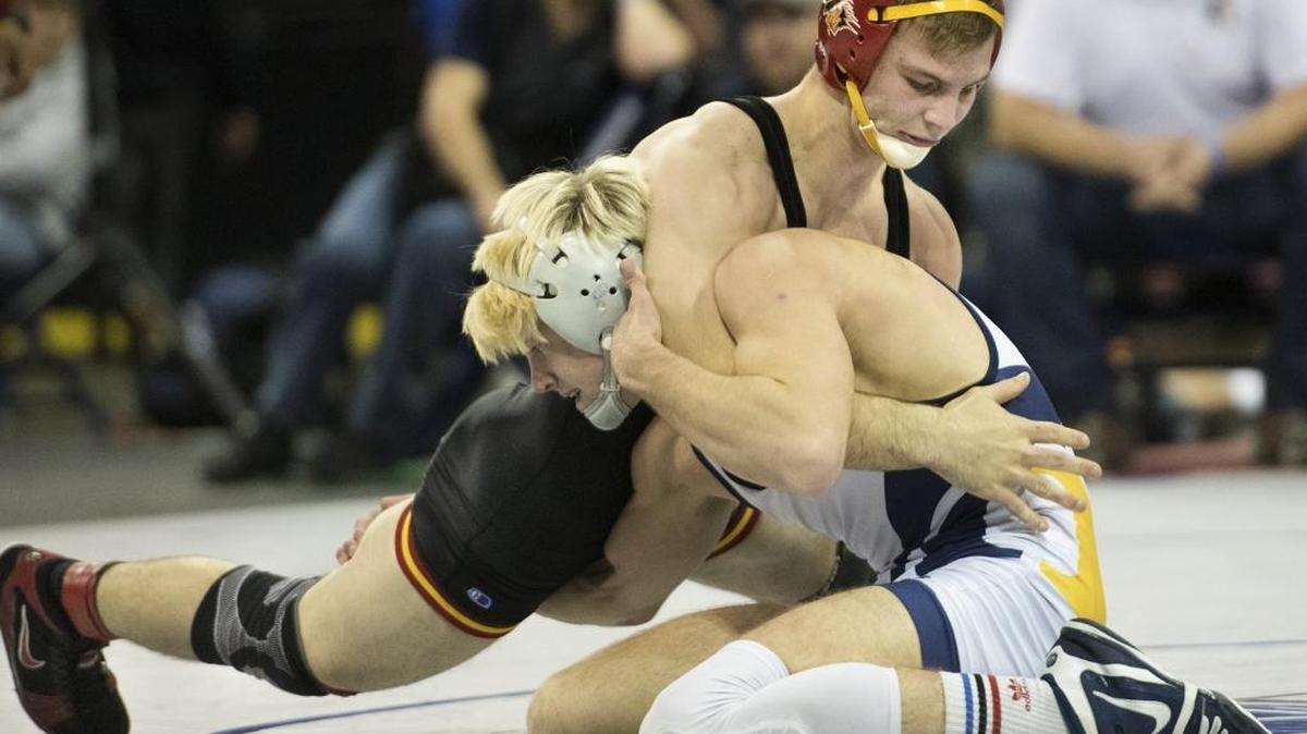 Oakdale's Jake Ryan (in black) wrestles Oak Ridge's Jackson Redhair in the 145-pound final during the Sac-Joaquin Section Masters Meet at Stockton Arena in Stockton, Calif., on Saturday, Feb. 24, 2018. Ryan won the title 9-2.