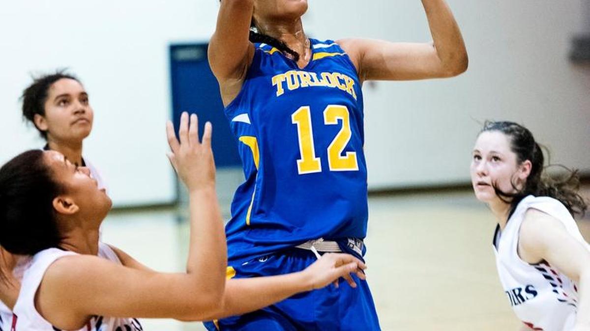 Turlock’s Jaydon Williams scores during the Crusader Classic Tournament game with Modesto Christian at Modesto Christian High School in Salida, Calif., Friday, Dec. 9, 2016. Modesto Christian won the game 49-40.