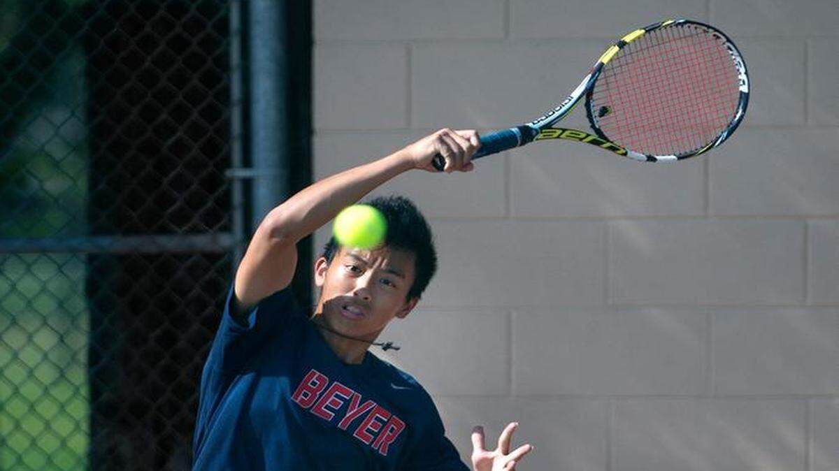 Beyer’s Gabe Quindara powers a topspin forehand during his match with Johansen’s Micheal Slyusarchuk on Thursday.