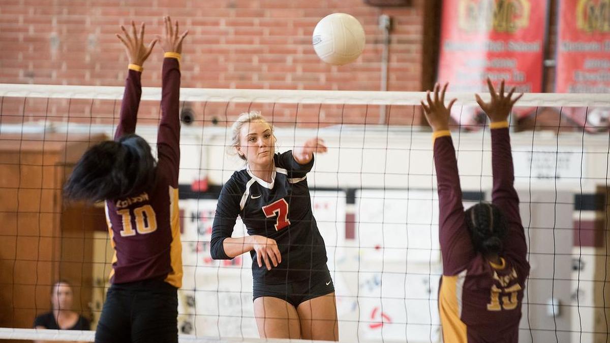 Modesto’s Tori Galloway spikes the ball past Edison defenders during Thursday’s match at Modesto High School in Modesto, Calif., on August 23, 2018.