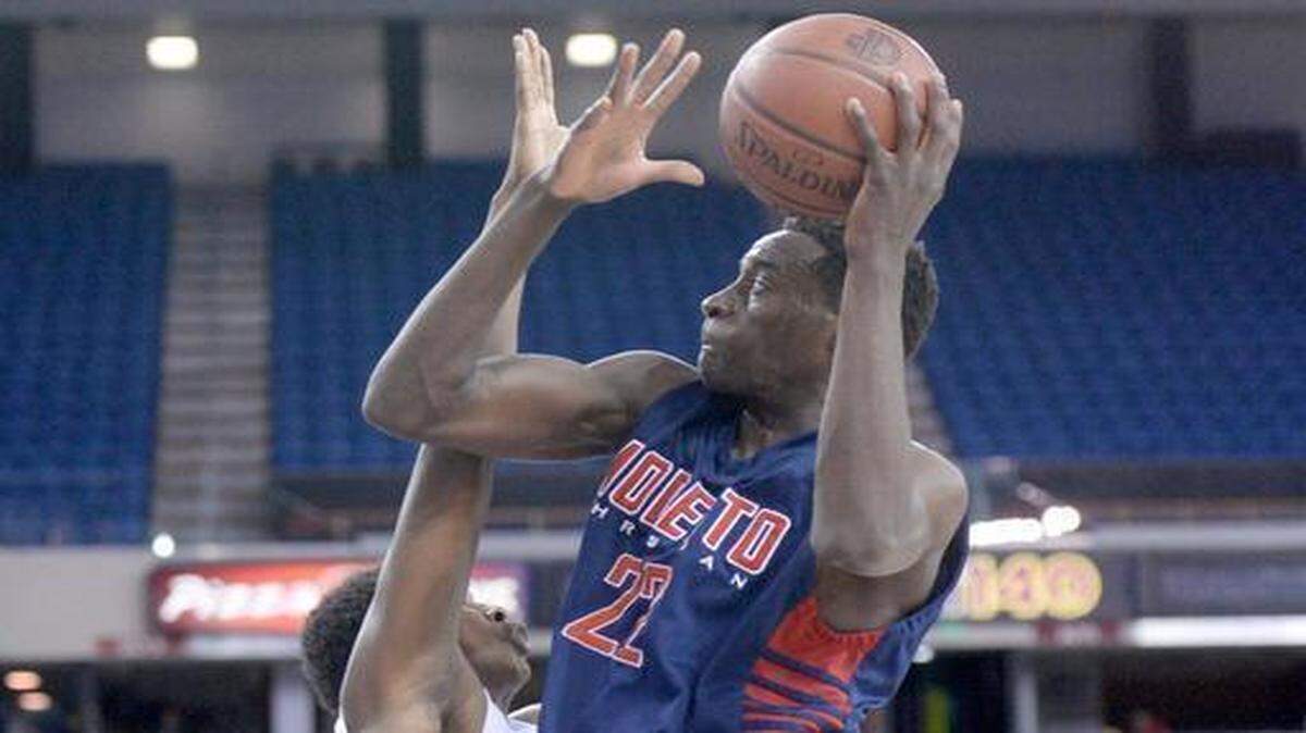 
Modesto Christian's Robinson Idehen Goes up for the layup during the NorCal Open Division championship game between MC and Bishop O'Dowd at Sleep Train Arena in Sacramento on March 21st, 2015.
