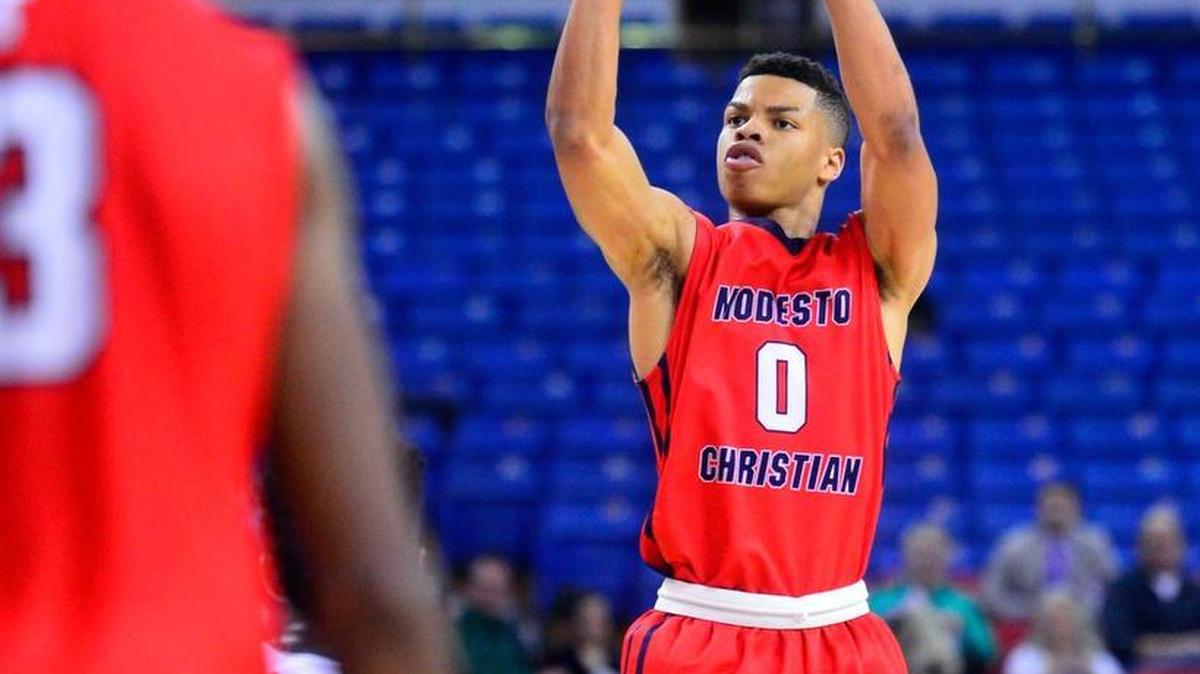 Modesto Christian guard Darrian Grays shoots a three during the CIF Northern California Open Division Championship where Modesto Christian was defeated by De La Salle 41-40 at Sleep Train Arena in Sacramento California on March 20, 2016.