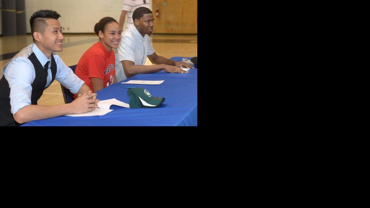 
Jeff Wu, Candice White, and Anthony Townes signed their letters of intent to attend Division I colleges before an enthusiastic crowd of parents, students, coaches and staff at Modesto Christian, Nov. 12, 2014.
