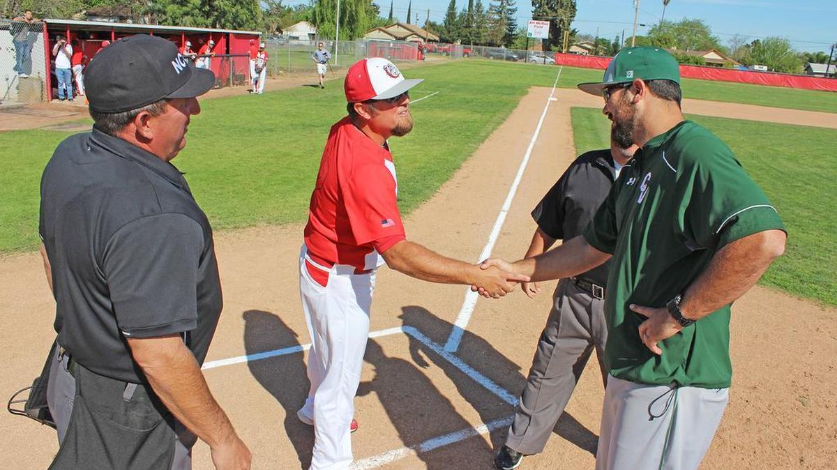 The Goblirsch brothers, Clinton (left) and Derrick (right), shake hands ahead of their Western Athletic Conference opener at Ceres High on Wednesday, March 23, 2016. Clinton is the head coach of the Bulldogs, while his younger brother Derrick is the skipper at Central Valley. Their teams could meet again at this week’s Art McRae Easter Tournament.