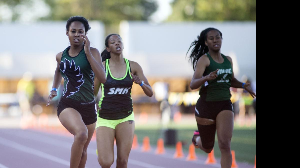 
Kiana Clay of Pitman High races toward the finish line in the Girls 400 Meter Dash during the Sac-Joaquin Section Masters track and field meet at Elk Grove High School in Elk Grove on May 29th, 2015. 
