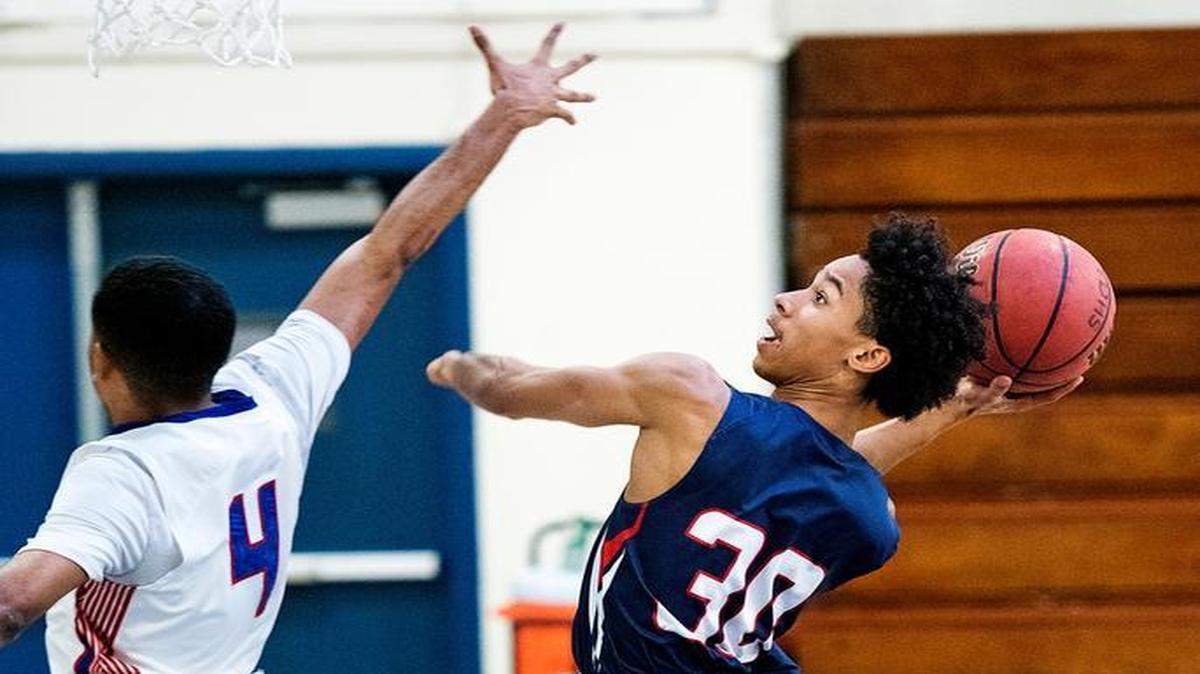 Beyer's Jaden Cobb takes a shot as Atwater's Reggie Ricks defends during the Modesto City Tournament at Downey High School in Modesto, Calif., on Thursday, December 1, 2016.