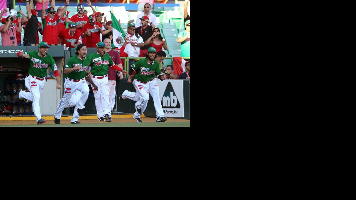 
Mexico’s baseball players – including Newman’s Terance Marin, second from the right – run to celebrate their victory over the Dominican Republic during a Caribbean Series semifinal on Saturday. Marin earned the win. 
