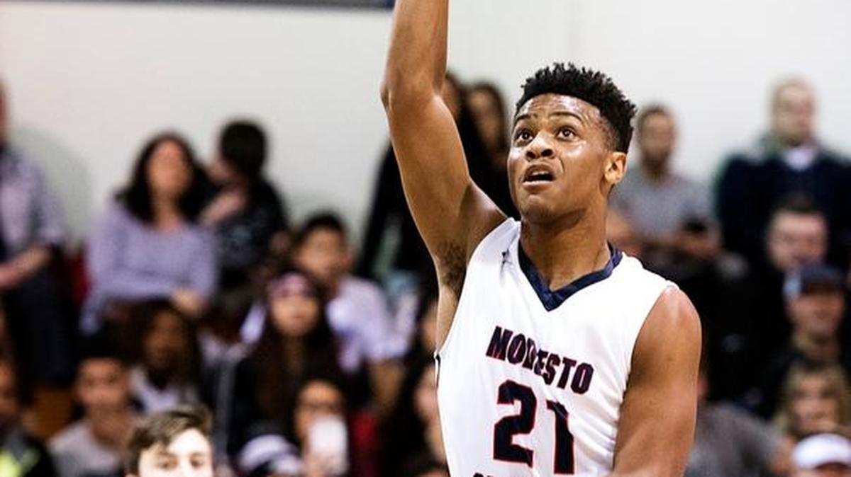 Jordan Hollins Buckner (21) takes a shot during the Modesto Metro Conference game at with Beyer at Modesto Christian High School in Salida, Calif., on Wednesday, Jan. 20, 2016.