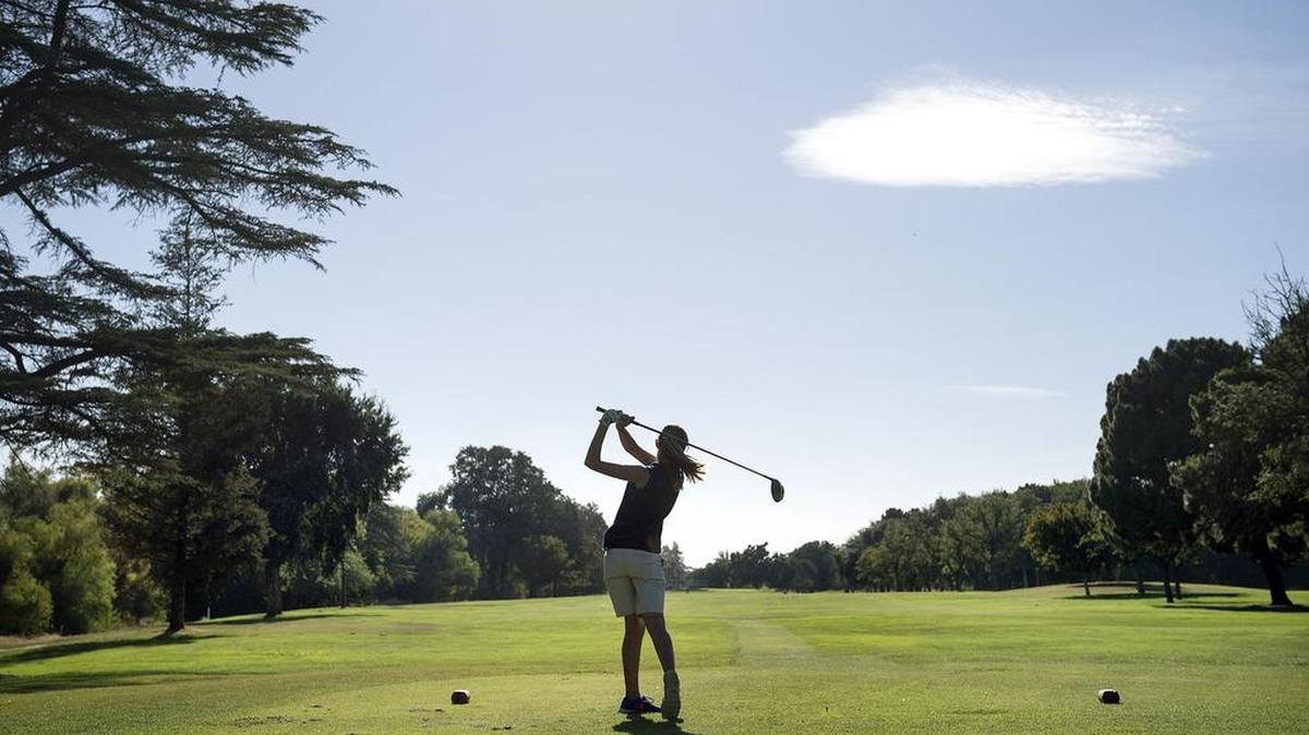 Downey junior Samantha Smedshammer is seen in 2014 as she tees off on the third hole during the Modesto Metro Conference match with Beyer at Dryden Park Golf Course in Modesto, Calif.