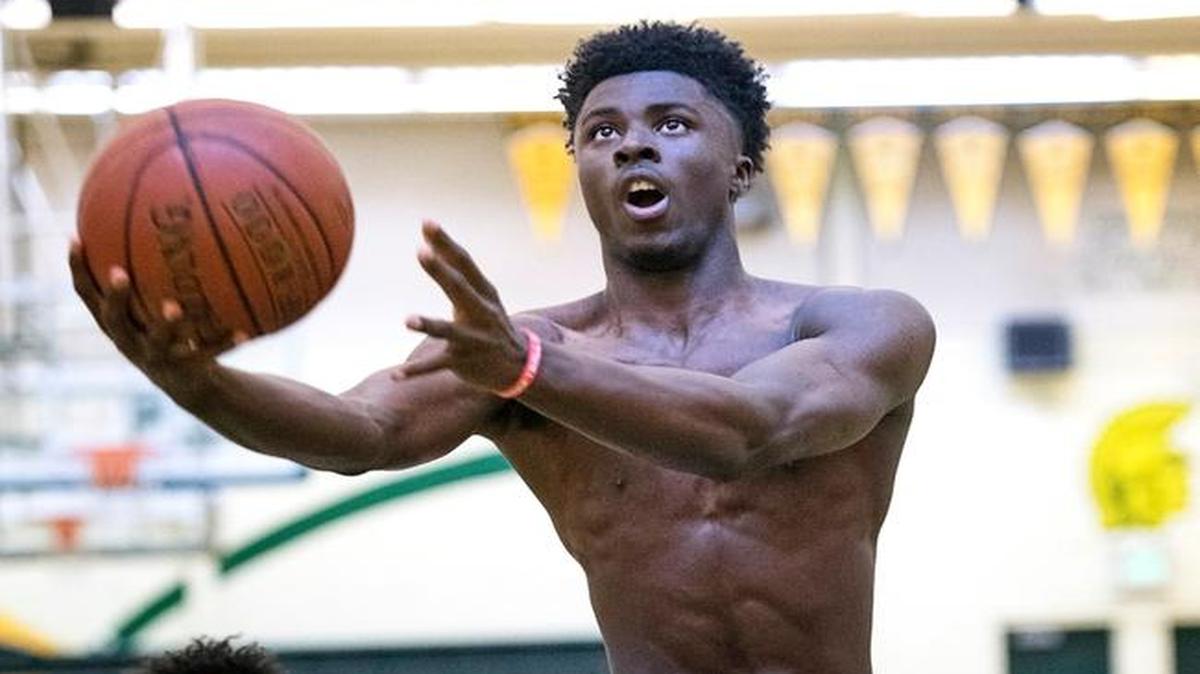 Chuck Hayes Basketball team member Tyler Williams lays the ball up during practice at Davis High School in Modesto, Calif., on Tuesday, April 4, 2017.