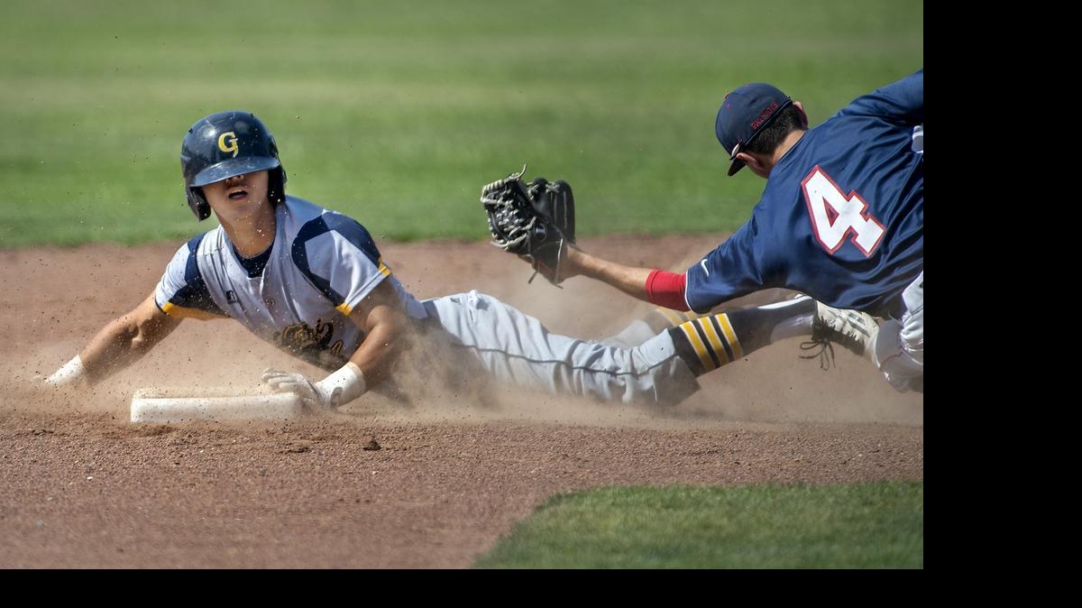 Gregori’s Andrew Urrutia beats the tag from Beyer shortstop Chris Alonzo as he steals second base during Wednesday’s game at Downey High School.  Beyer won the game 2-0 behind pitcher Micah Hall, who improved to 11-0 on the season.